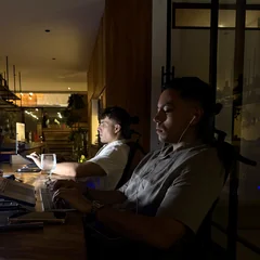 Ali Jaafari, founder of We Developz, working at his laptop
